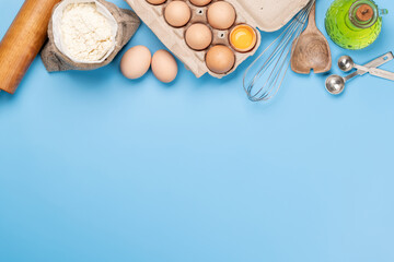 Cooking ingredients and utensils on blue background