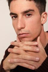 Fototapeta premium Handsome man with serious expression and ideas, looking at the camera. Mindset.