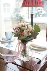 Fototapeta na wymiar a beautiful bouquet on a server table in a restaurant 