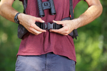 a young traveler putting rucksack