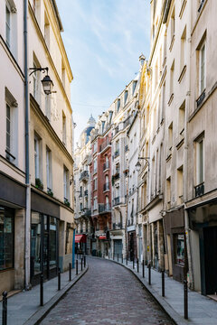 France, Ile-de-France, Paris, Narrow street stretching between rows of residential buildings