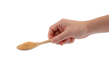 Hand and brown sugar on wooden spoon on a transparent background.
