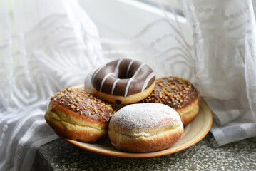 Colorful donuts on a plate