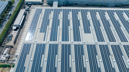 Top view Solar Cell on Warehouse Factory. Solar photo voltaic panels system power or Solar Cell on industrial building roof for producing green ecological electricity. Production of renewable energy.
