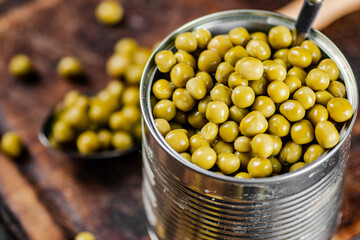 Canned green peas on a cutting board. 