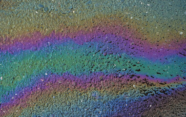 Pollution with petrol on asphalt. A big gasoline stain on the road, Concept image for this dangerous way to enhance pollution of global environment.