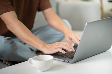 Man work from home. work online on laptop. Asian businessman working online business concept with social distancing laptop online meeting.