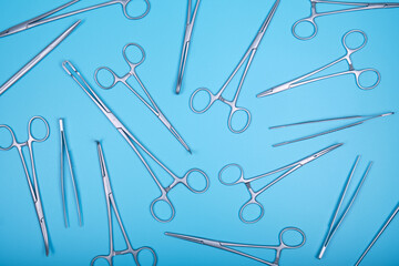 Surgical instruments on a blue.