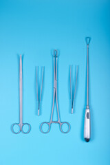 Surgical instruments on a blue.
