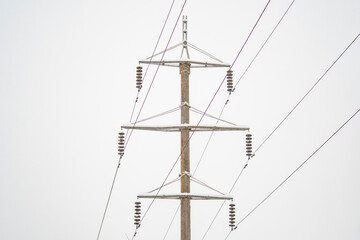 High voltage power line pole in winter. Background on the theme of energy and transmission of...