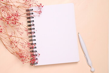 Blank notebook sheet, open page, on wooden background