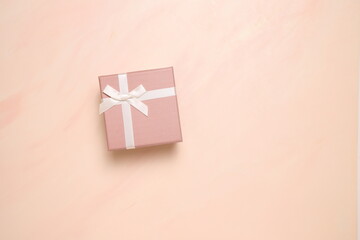 Present box on wooden background, copy space