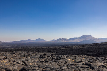 Views across the black lava volcano field of Jabal Qidr in the Harrat Khaybar region, north west...