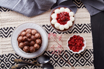 Aesthetic no baking vegan dessets. Trendy gluten free raspberry, cherry cupcakes flat lay. Dreamy Escapism concept