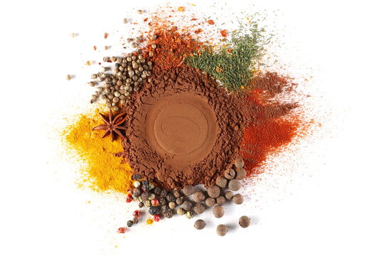 Mixed spice, cocoa powder, allspice, colorful peppercorns, turmeric, star anise, coriander, chopped hot pepper, dill, cinnamon ground, cayenne pepper isolated on white, top view 