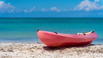 Kayak resting on a Caribbean beach
