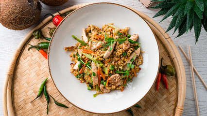 Pilaf with pork, sweet pepper, carrots, onions, green peas and microgreens.