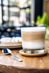 Coffee and cake on a cafe table outside. Morning, drink, good mood concept