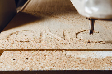 Cnc machine working, cutting wood. Woodwork industry.
