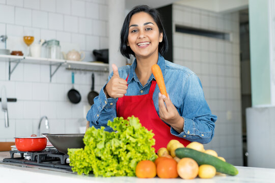 Hispanic woman preparing vegetarian or vegan food