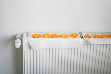 The idea of ​​drying an orange citrus slice on the heater core radiator, herbal tea of winter,...