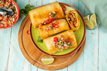 Traditional Mexican fast food chimichanga top view.