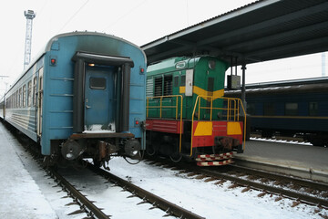 Passenger train with diesel locomotive at the station, infrastructure of Ukraine