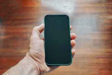 hand holding a smart phone, phone addicted