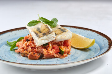 white fish with rice and vegetables