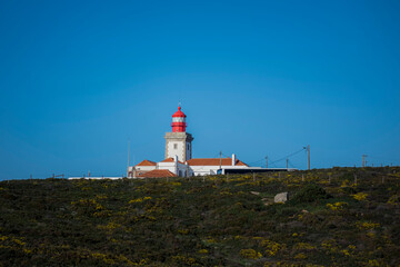 Fototapeta na wymiar Lighthouse building at Cape Roca on the Atlantic coast of Portugal. .