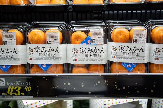 KUALA LUMPUR, MALAYSIA - APR 23, 2022: Japan brand Furu Furu House Mikan orange on the shelf of Donki Malaysia