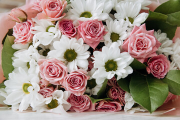 Background of beautiful bouquet of rose and chrysanthemums flowers. Backdrop for holiday, birthday, Wedding, Mother's Day, Valentine's day, Women's Day. Floral arrangement.