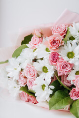Background of beautiful bouquet of rose and chrysanthemums flowers. Backdrop for holiday, birthday, Wedding, Mother's Day, Valentine's day, Women's Day. Floral arrangement.