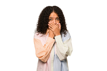 Young african american curly woman isolated covering mouth with hands looking worried.