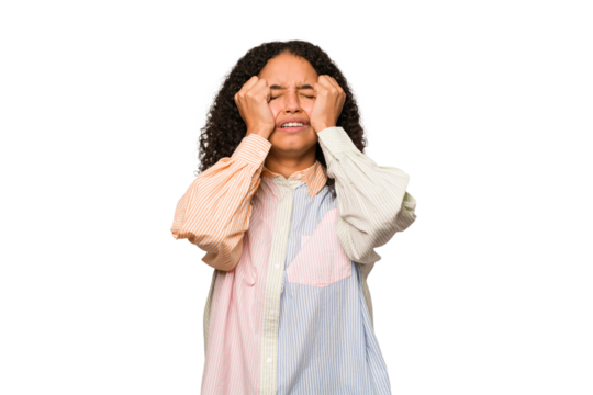 Young african american curly woman isolated crying, unhappy with something, agony and confusion concept. - Powered by Adobe