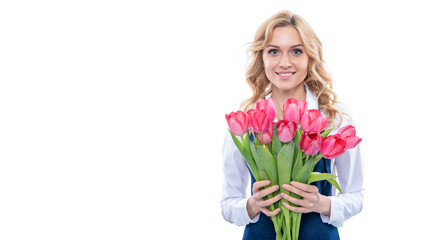 happy young woman in apron with spring tulip flowers isolated on white background