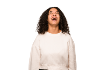 Young african american curly woman isolated shouting very angry, rage concept, frustrated.