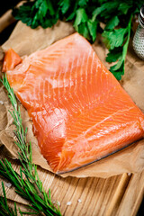 A piece of salted salmon on paper. 