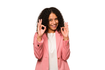 Young african american curly woman isolated cheerful and confident showing ok gesture.