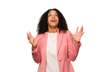 Young african american curly woman isolated screaming to the sky, looking up, frustrated.