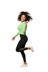 Young african american woman jumping with energy isolated