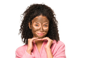 Young african american curly woman wearing a bathrobe and a facial mask isolated