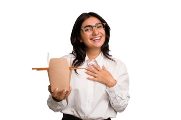 Young business indian woman eating takeaway noodles cut out isolated laughs out loudly keeping hand on chest.