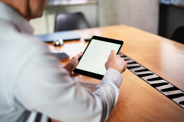 Close up of man using digital tablet..