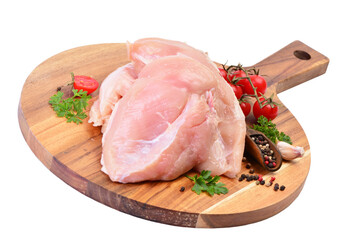 Raw chicken meat on a wooden board isolated