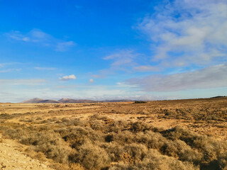 The arid land on the island of Fuerteventura on a sunny day with a clear sky