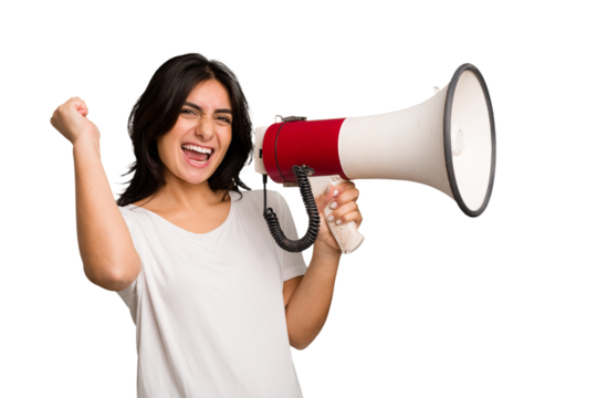 Young Indian woman holding a megaphone isolated