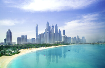 Fototapeta premium Dubai, UAE. Dubai Marina skyscrapers, complex of residential and office buildings with beautiful white sand beaches