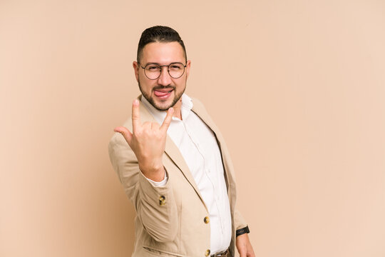 Adult latin business man cut out isolated showing rock gesture with fingers