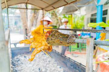 Crocodile grill. Crocodile grilled for tourists. Vietnam, Doclet. 